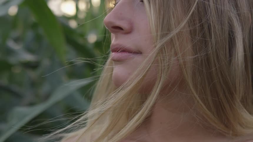 The wind blows the woman's hair