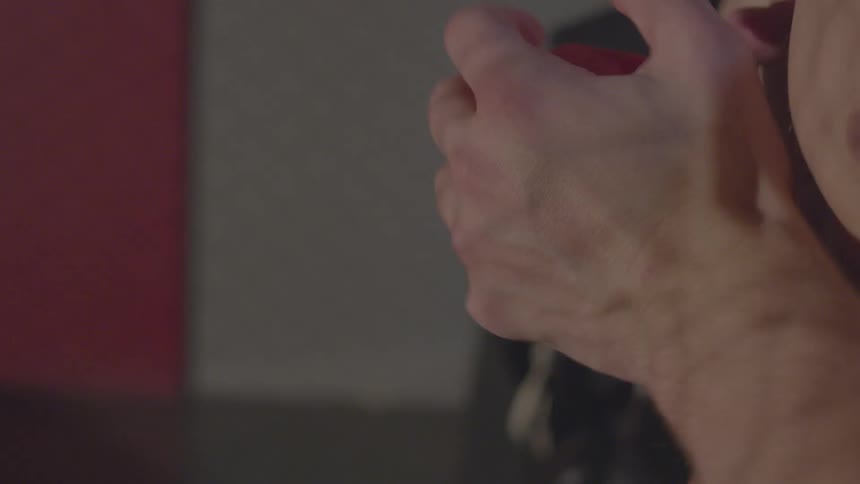 A boxer puts athletic tape on his fist