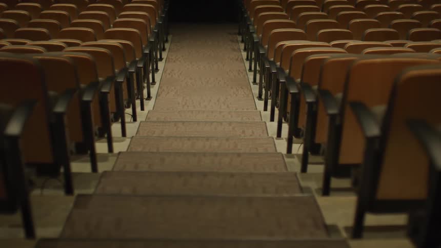 The steps and seat in an empty auditorium