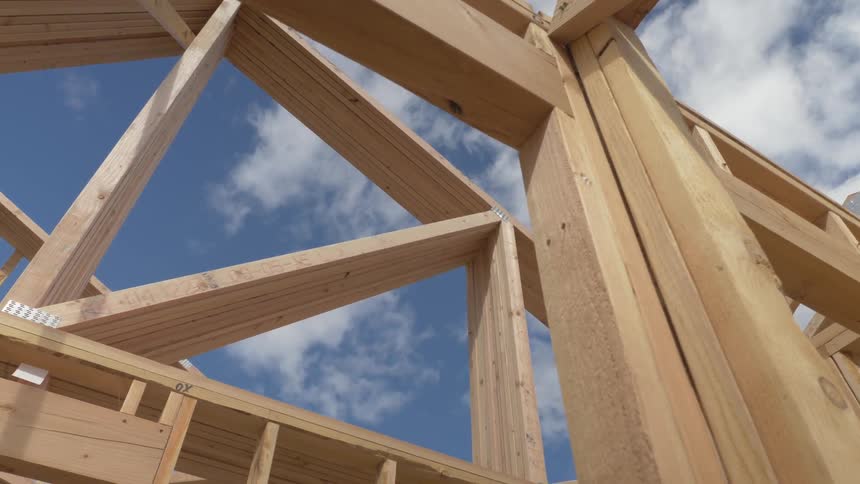 Construction site of house being built on sunny day