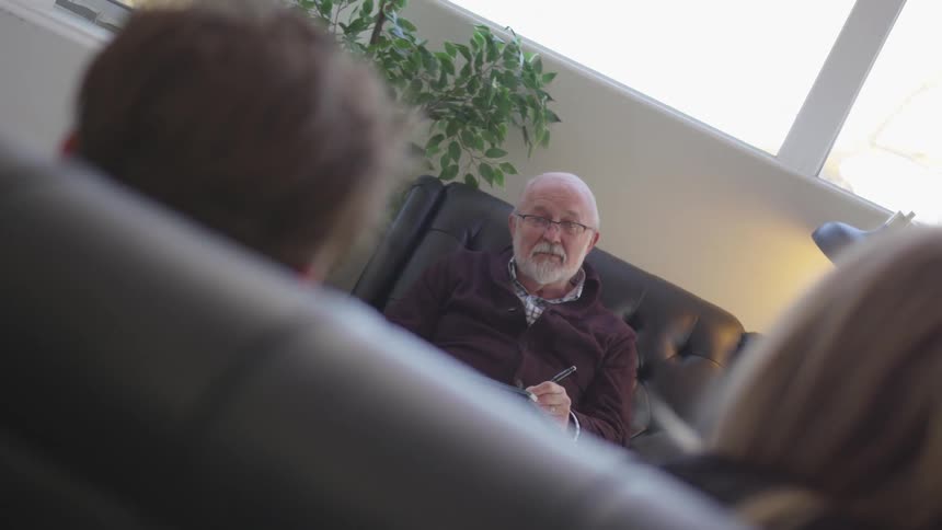 A psychiatrist talks with a couple