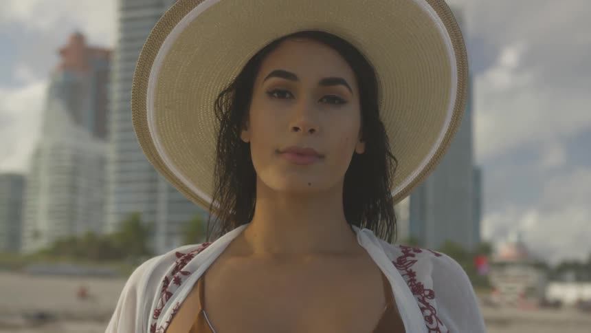 A woman walks out on the beach