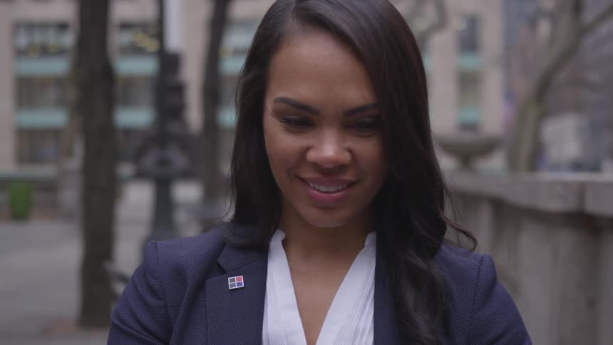 A woman smiles in the city