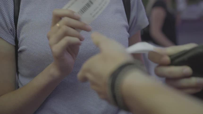 People get their tickets at a carnival
