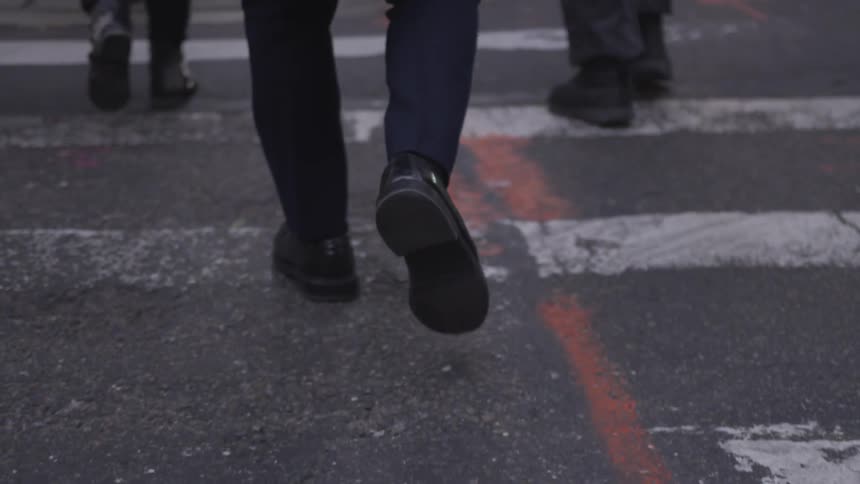 Pedestrians cross a city street