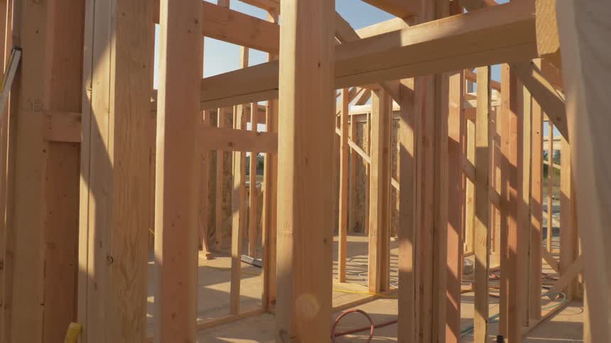 Construction site of house being built on sunny day