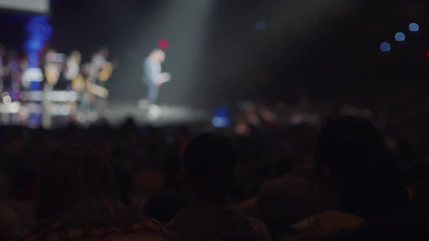 The spotlight is on the band on stage