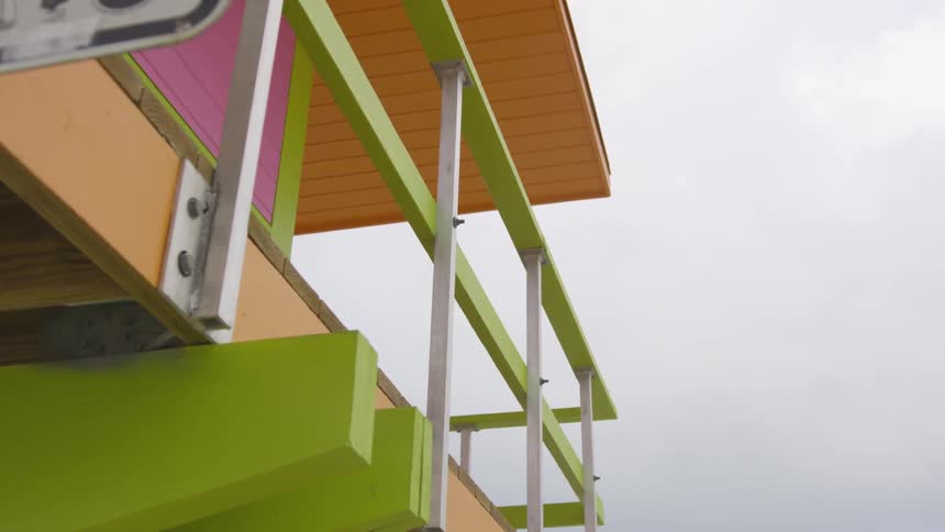 The lifeguard stand has neon colors