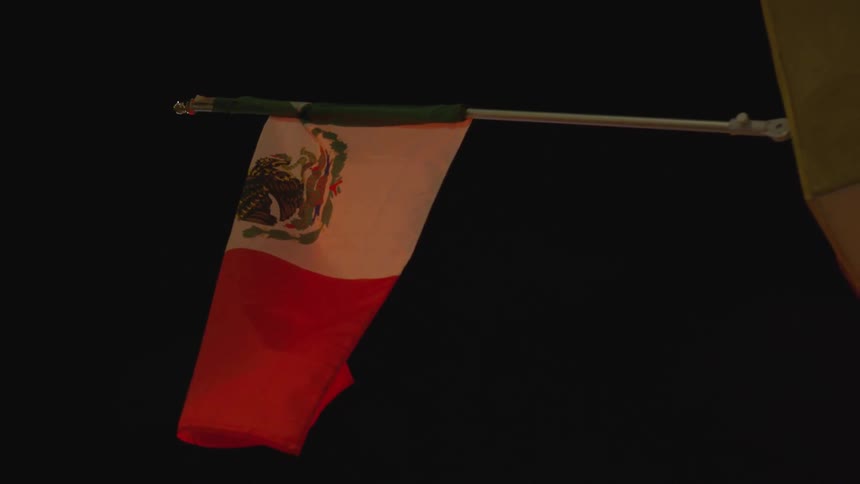 A flag is hanging at night