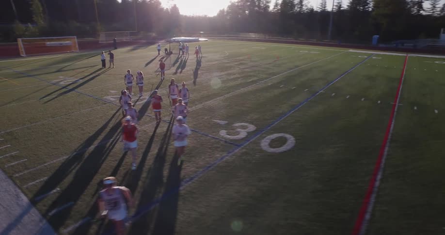 The cheerleaders jog off the field