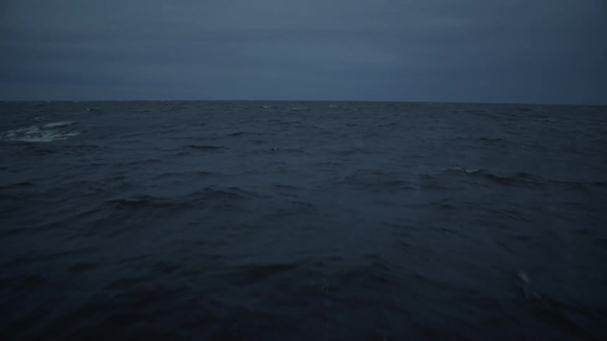 A calm ocean at dusk