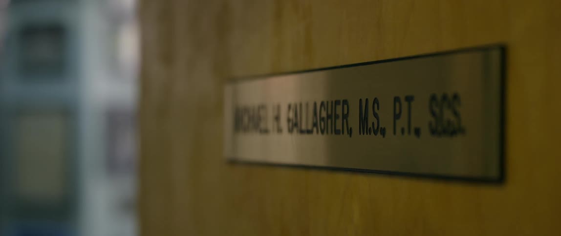 Doctor's name printed on a sign on a door