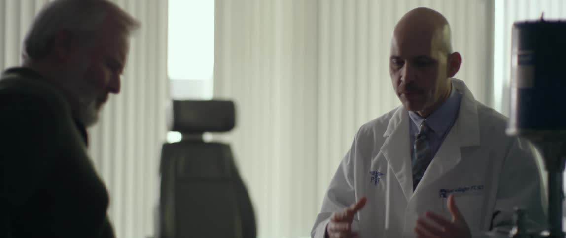 The doctor talks with his patient