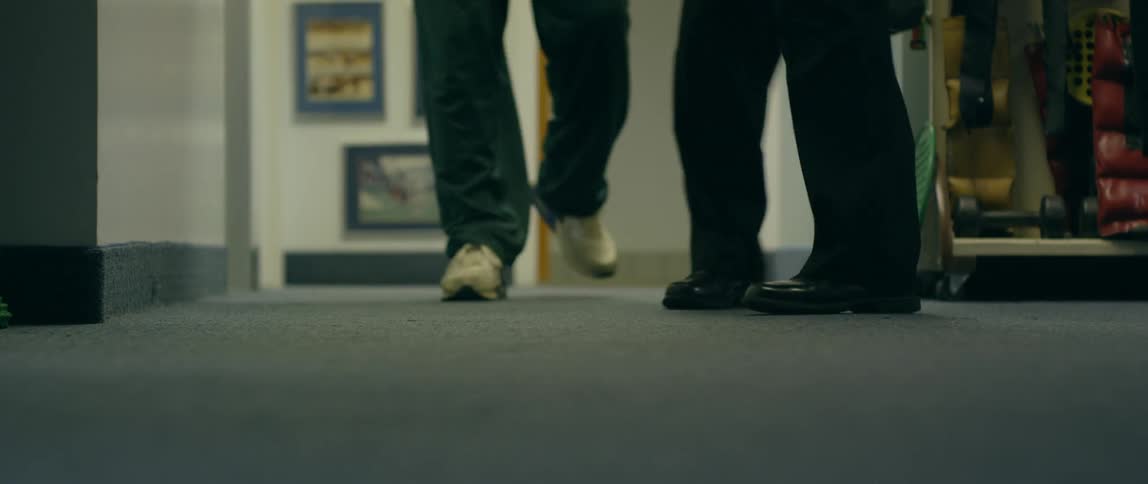 People walk down the hall together