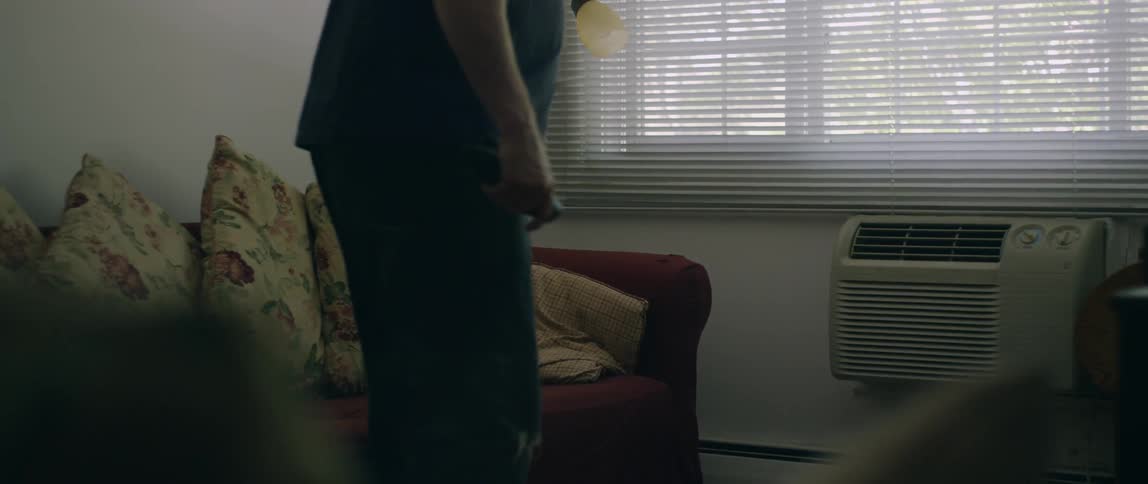 A man sits down to watch some television