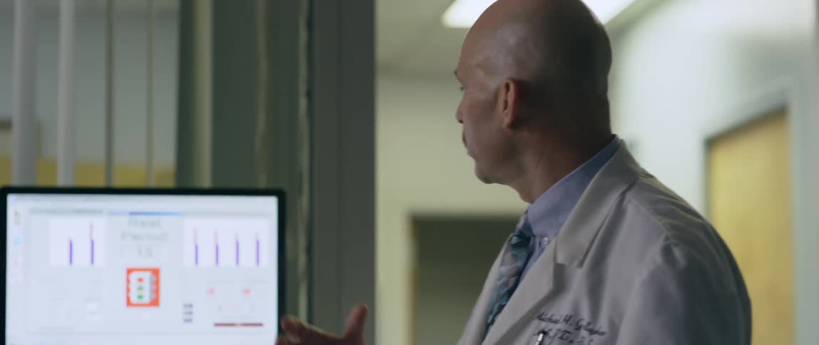 A doctor is explaining something in the office