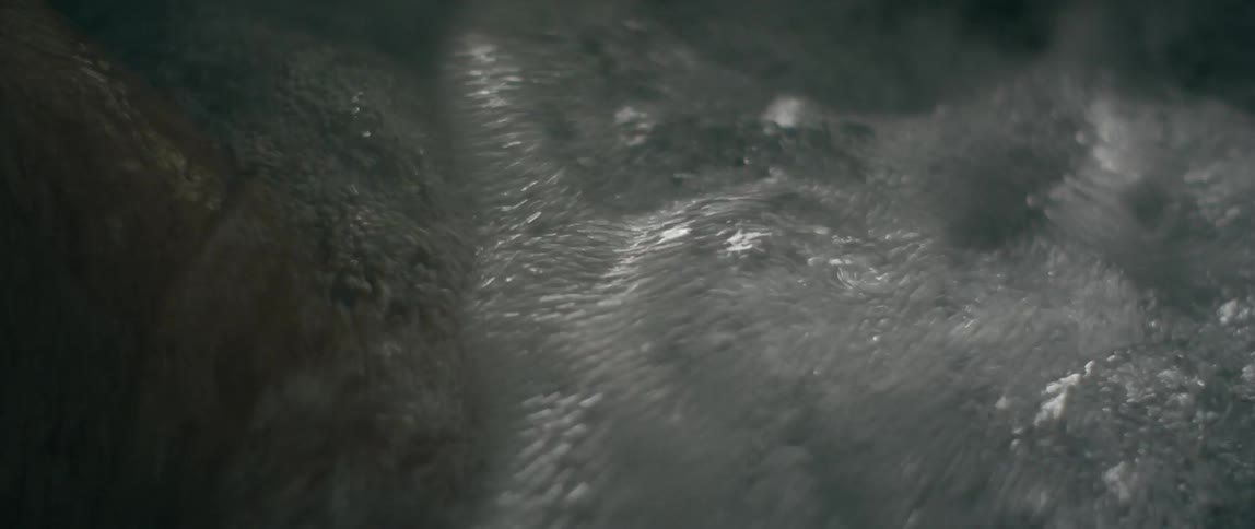 A man's leg soaking in a hot tub