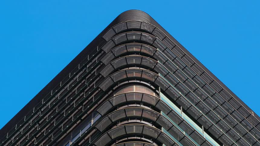 The sky is perfectly clear above the tall building
