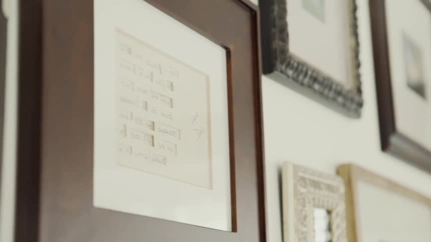 The wall is full of many frames
