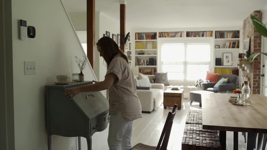 A woman opens the lid on her desk