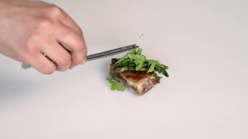 A plate is being set for a meal