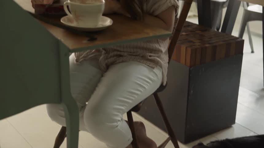 Dog Chewing on Toy and Woman Writing Letter