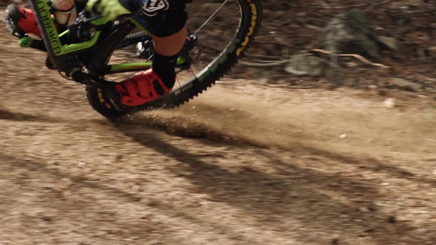 The person makes a sharp turn on their bicycle
