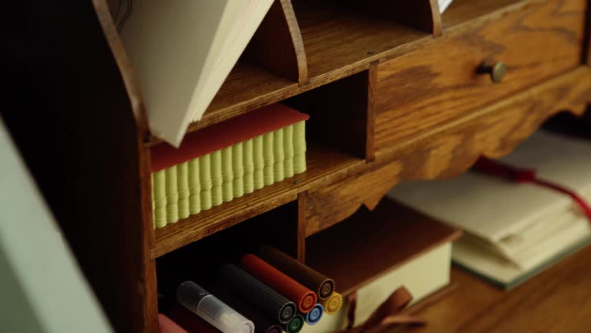The desk has many markers and papers