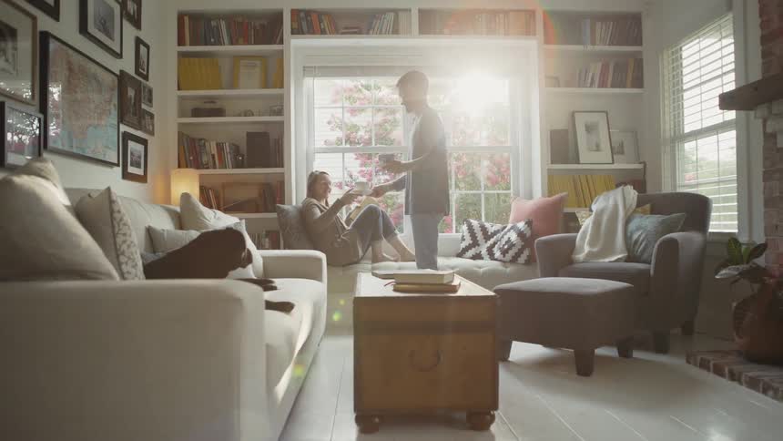 Man Brings Tea to His Wife in Living Room