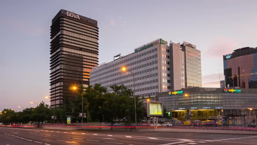 The cars pass by the intersection of the city