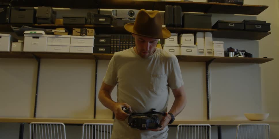 A man is working on his electronic device