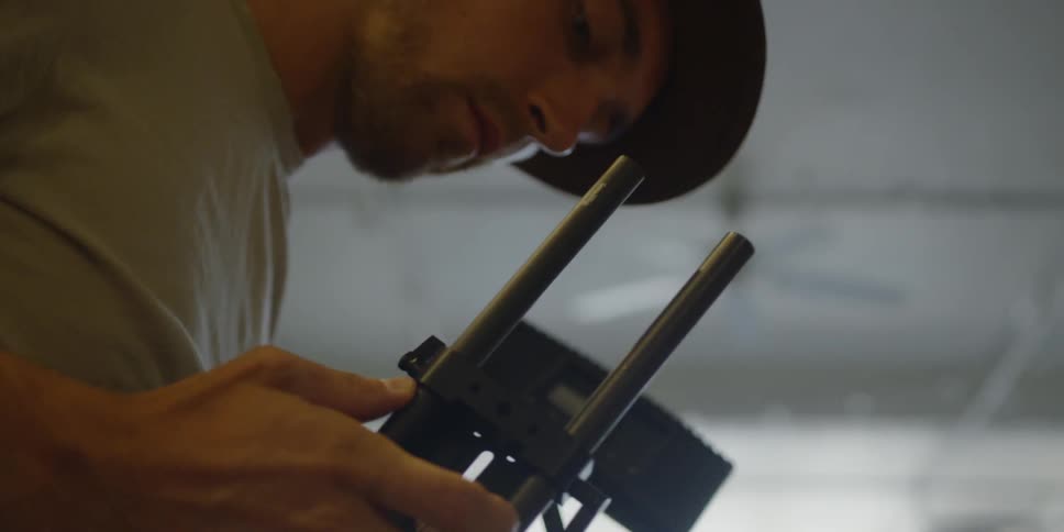 Man tries to piece together a metal object