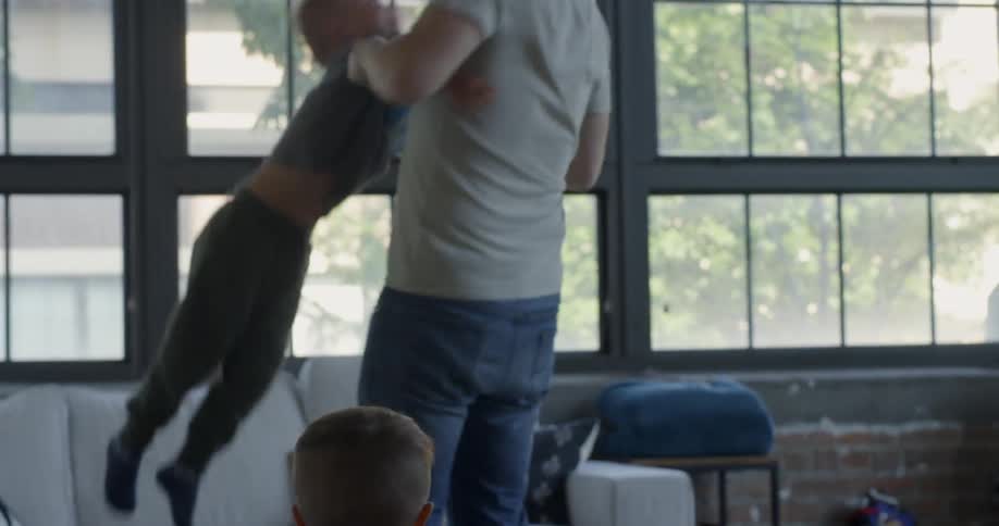 Young Family At Home Playing