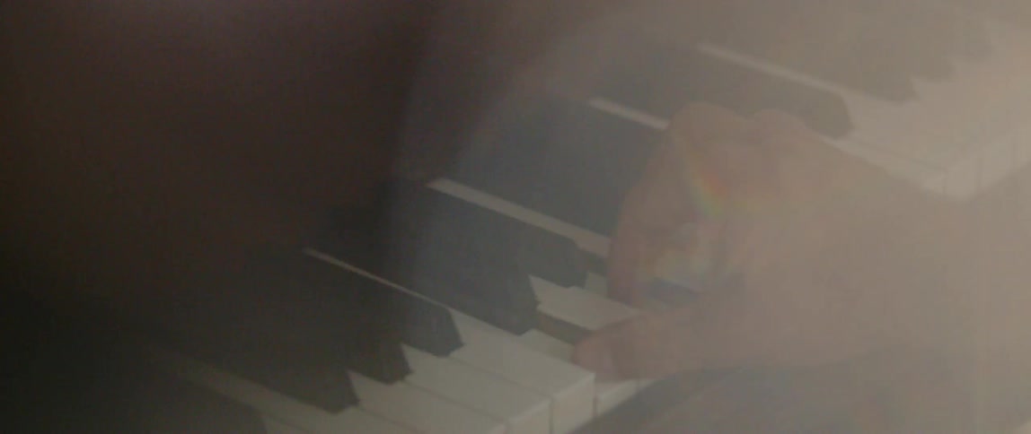 A person plays a piano