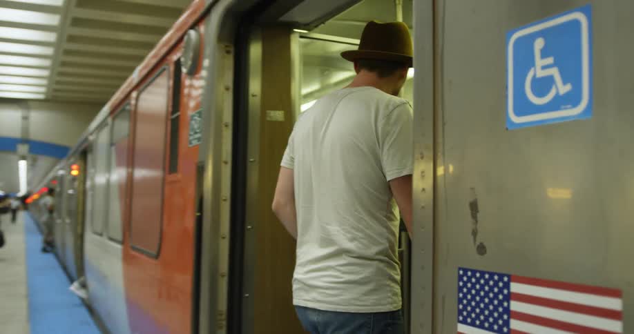Man walks onto a subway