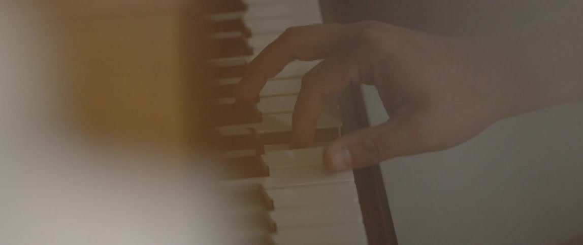 A person plays a piano