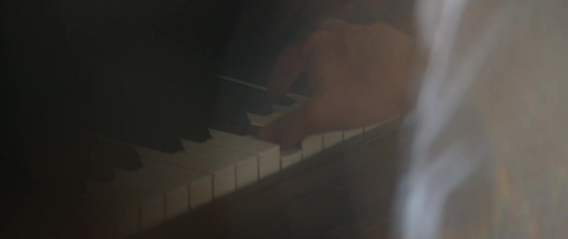 The person is playing the piano