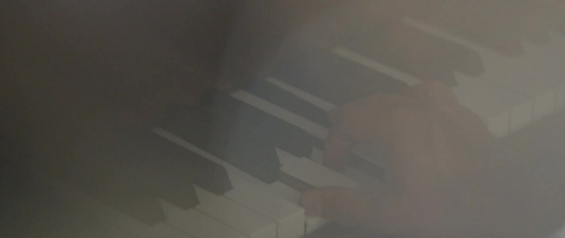 A person plays a piano