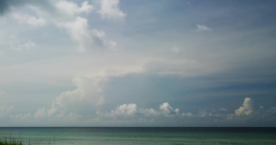 A timelapse of clouds floating over the ocean