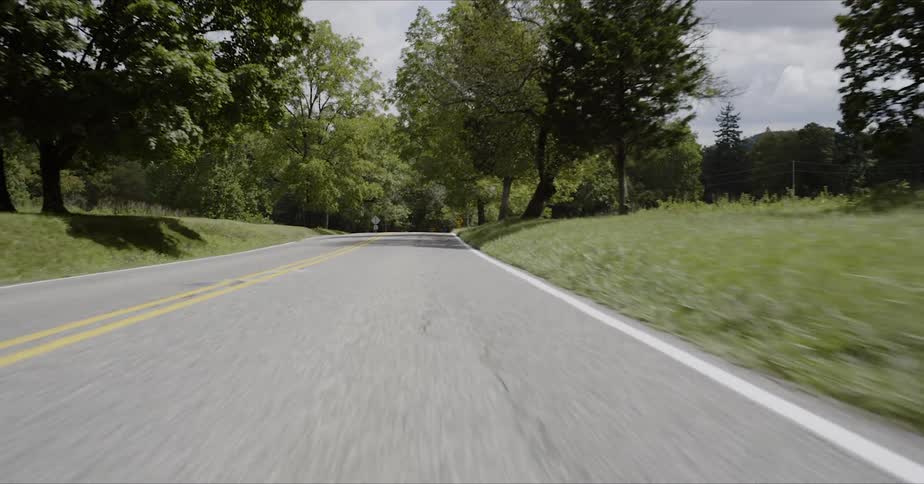 A car is driven in the countryside