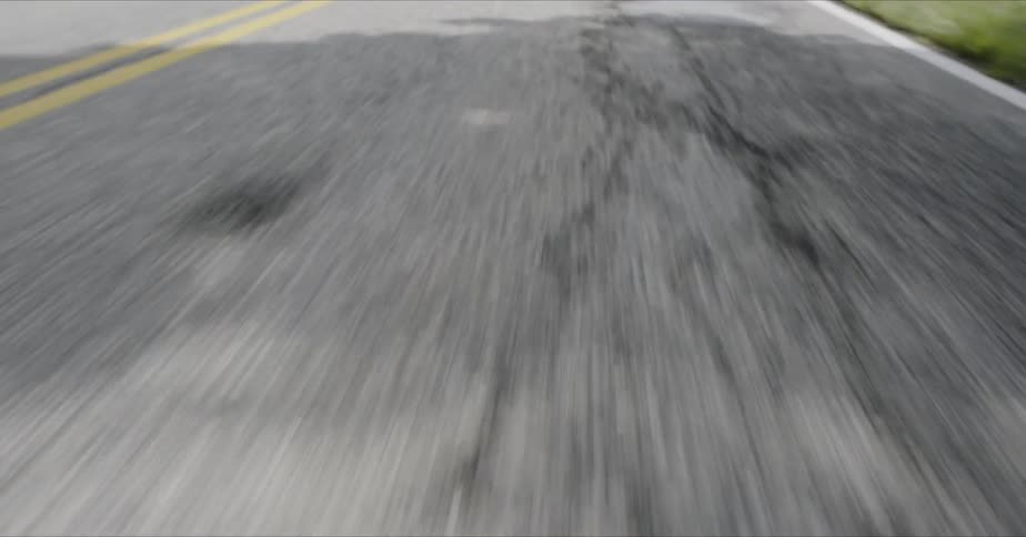 Yellow line running down the middle of a country road