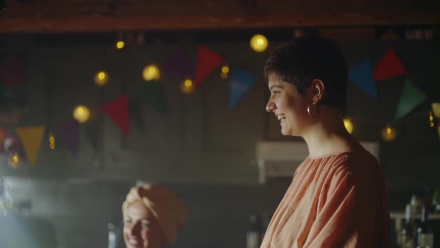Smiling woman talks and nods her head