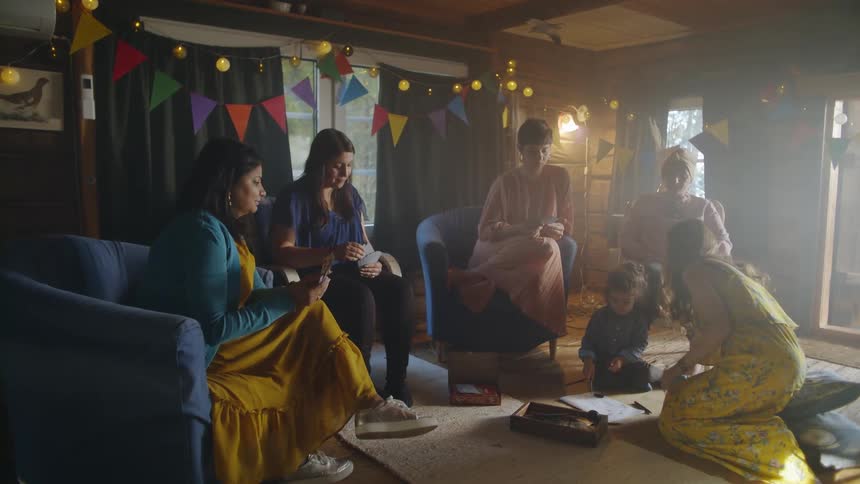 Women play cards at a party