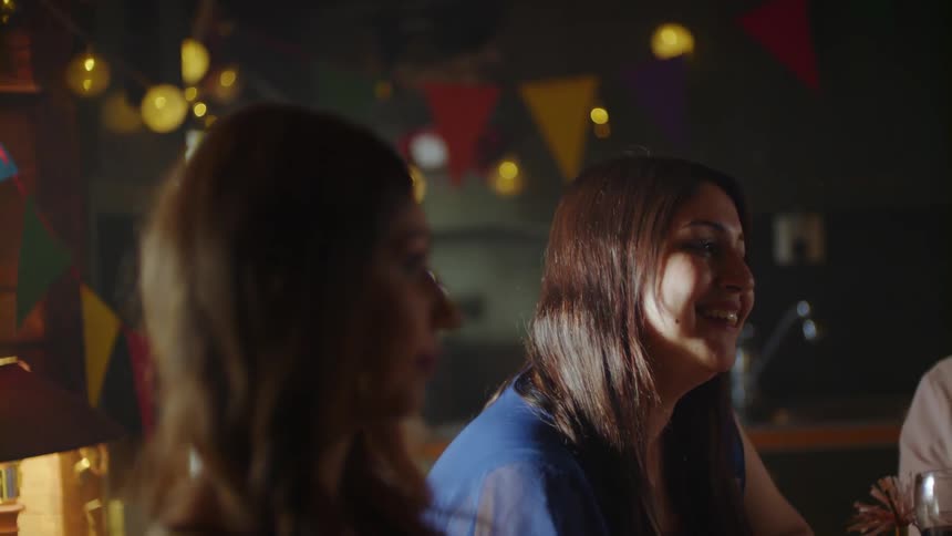 Women have fun talking together at a party