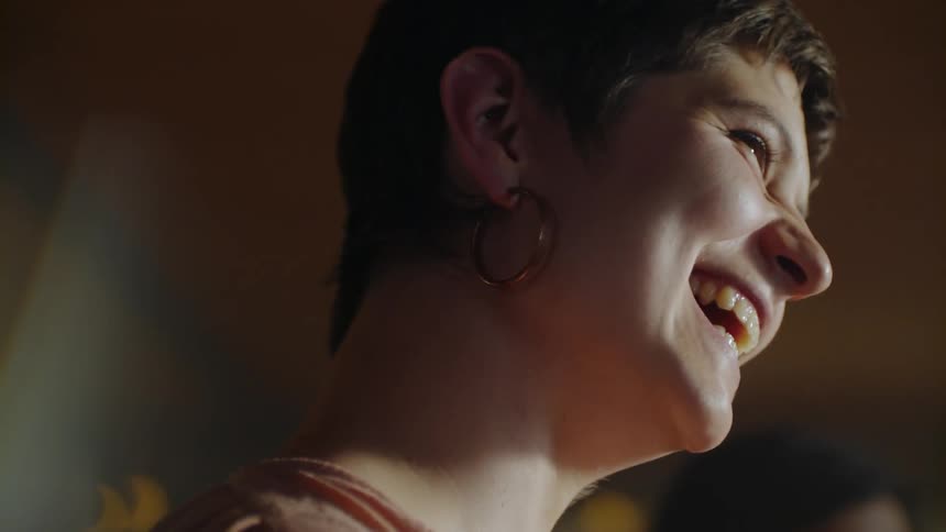 Woman is talking and laughing in house