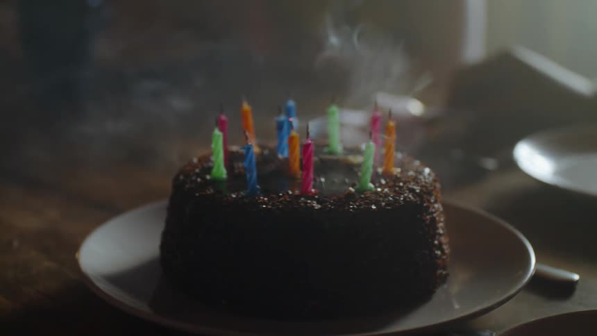 Candles are blown out on a birthday cake