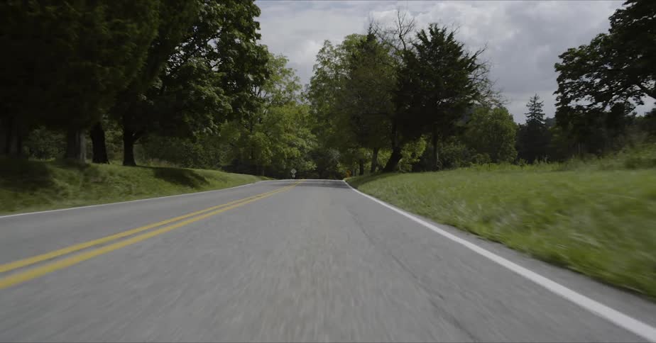 Yellow line running down the middle of a country road