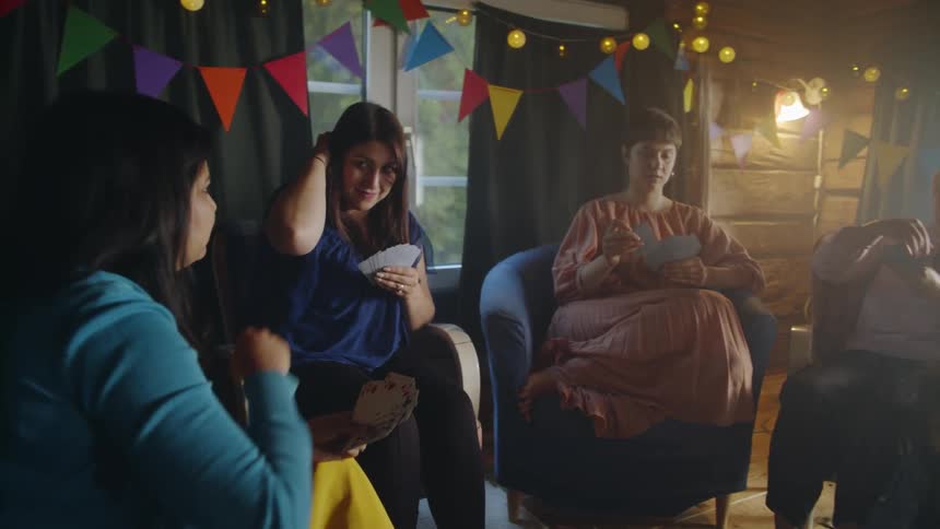 Women play cards at a party