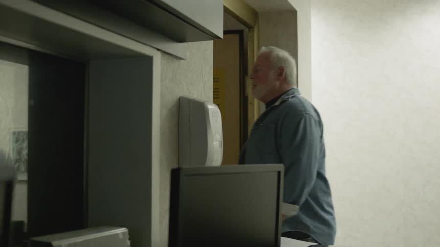 A man walks out of an exam in a clinic