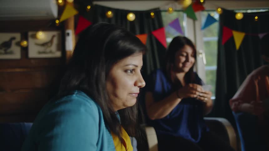 The woman talk and play cards